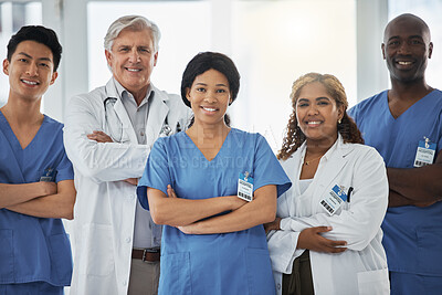Buy stock photo Smile, portrait and team of doctors with arms crossed standing together in hospital. Face, confident or medical professionals, nurses or surgeon group with healthcare collaboration, teamwork or trust