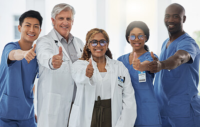 Buy stock photo Thumbs up portrait, doctors and team of nurses together in happy hospital. Face, like hand and medical professionals, surgeons or group emoji for success, collaboration and support for healthcare.