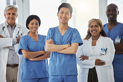 Buy stock photo Portrait, nurses and group of doctors with arms crossed standing together in hospital. Face, confident and medical professionals, team and happy surgeons in collaboration, teamwork and healthcare.