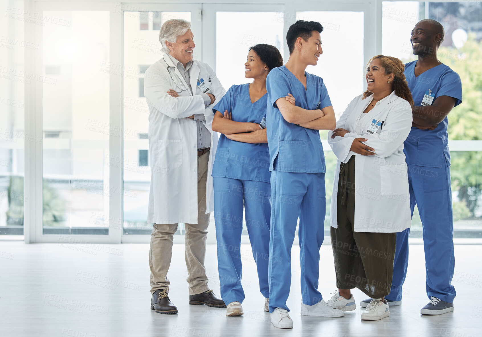 Buy stock photo Group, teamwork and doctors with arms crossed in meeting for medical diagnosis, discussion or wellness. Confident surgeon, happy and people in conversation for collaboration or healthcare service