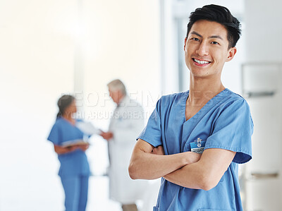 Buy stock photo Portrait, happy man and Asian nurse with arms crossed in hospital or clinic. Face, confidence and medical professional, male surgeon or doctor with pride for career, job and healthcare for wellness.