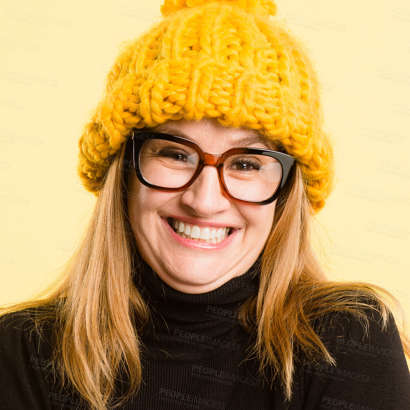 Buy stock photo Portrait, beanie and woman with smile, glasses and confident girl on yellow studio background. Face, person and model with eyewear, excited or winter clothes with hat, wool and fashion with happiness