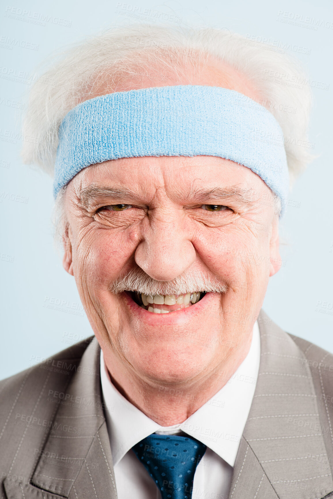 Buy stock photo Shot of a senior man standing alone in the studio and laughing