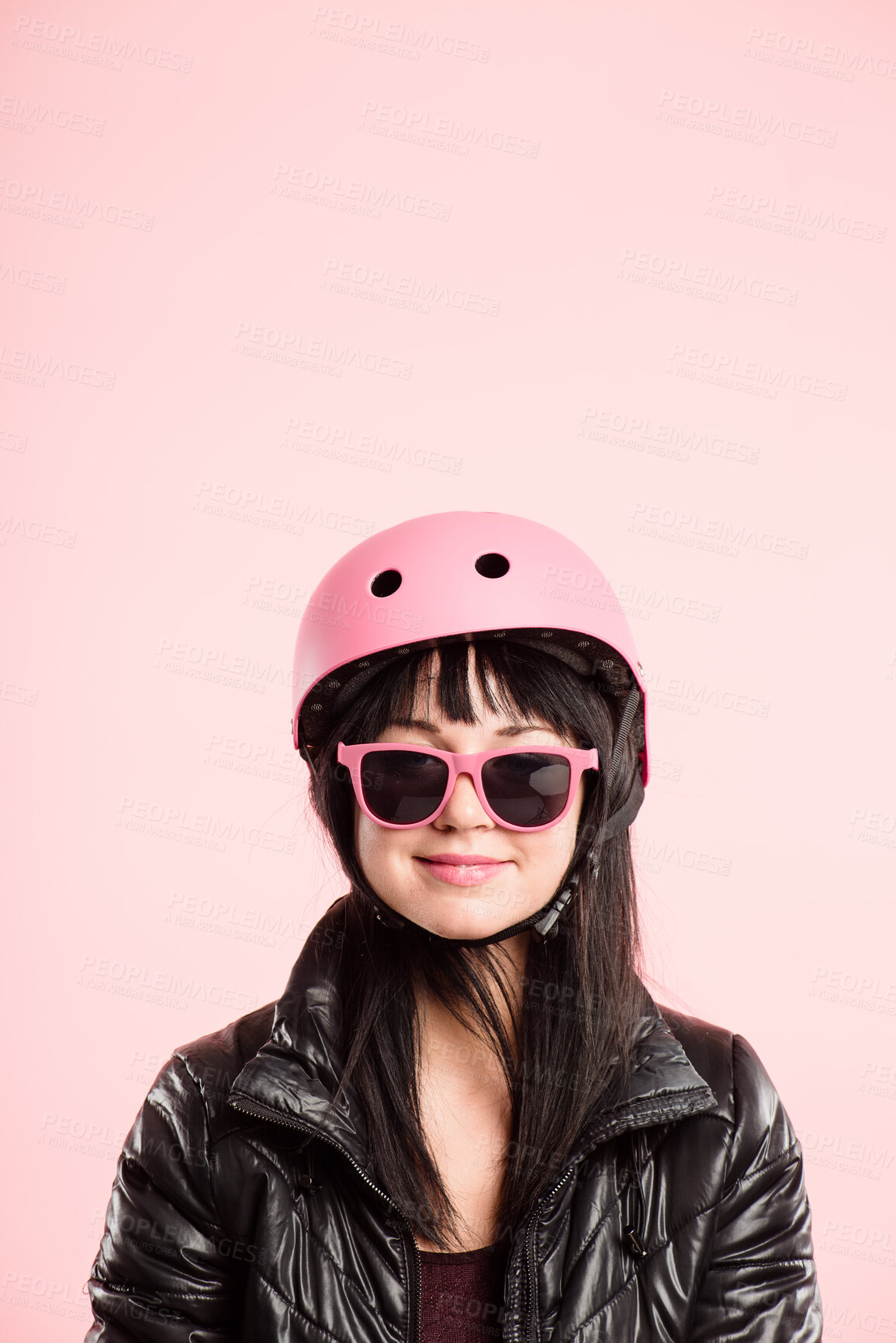 Buy stock photo Helmet, portrait and sunglasses with woman in studio isolated on pink background for cycling activity. Eyewear, face and safety with happy person on mockup space for fashion, fitness or health