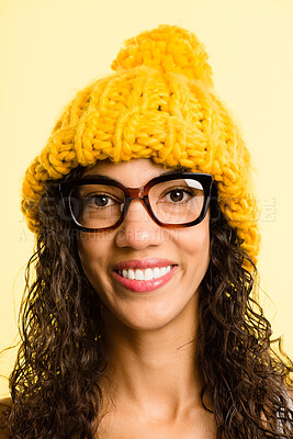 Buy stock photo Portrait, woman and beanie with smile for fashion, winter weather and warm clothes cold morning. Happy, African girl and knitted hat for stylish aesthetic, trendy glasses and studio background