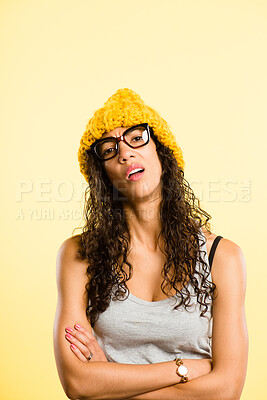 Buy stock photo Portrait, black woman and confused with beanie for fashion, winter weather and warm clothes in morning. Pride, African girl and knitted hat for stylish aesthetic, trendy glasses and studio background