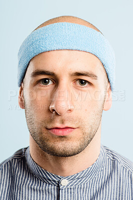 Buy stock photo Vintage, exercise and portrait of man with headband, serious and workout coach for gym in studio. Pride, face and male person with retro style, fitness fashion or confidence on blue background.