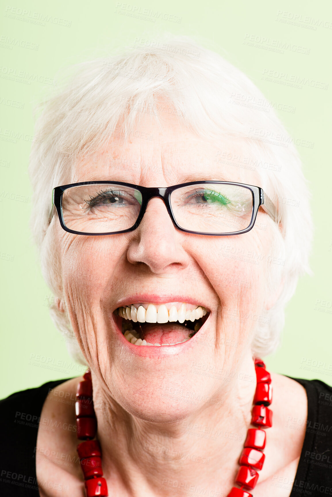 Buy stock photo Senior woman, laugh and studio for glasses in retirement, confidence and green background. Female person, designer frames and prescription eyewear for healthcare, eye care and proud of ophthalmology