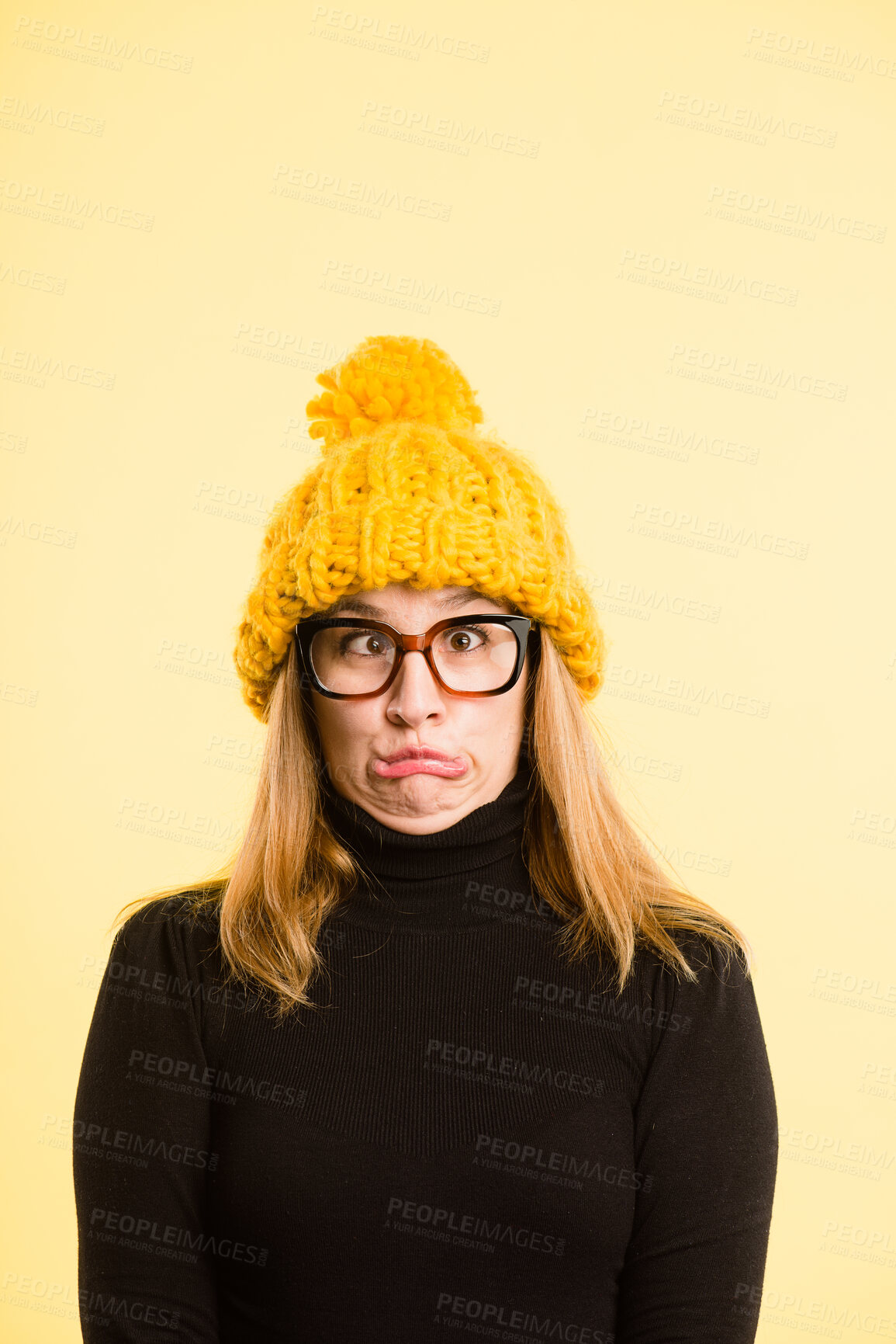 Buy stock photo Goofy, woman and beanie for portrait of fashion, winter weather and warm clothes cold morning. Silly, girl and knitted hat for stylish aesthetic, trendy glasses and crazy comedy on studio background
