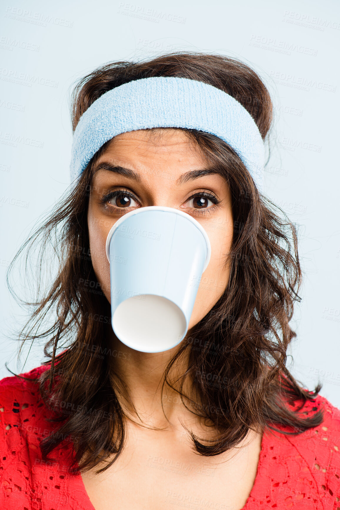 Buy stock photo Funny, crazy and woman with coffee cup in studio for fitness with retro headband for workout. Caffeine addict, goofy and female athlete drinking takeaway cappuccino with vintage exercise fashion.