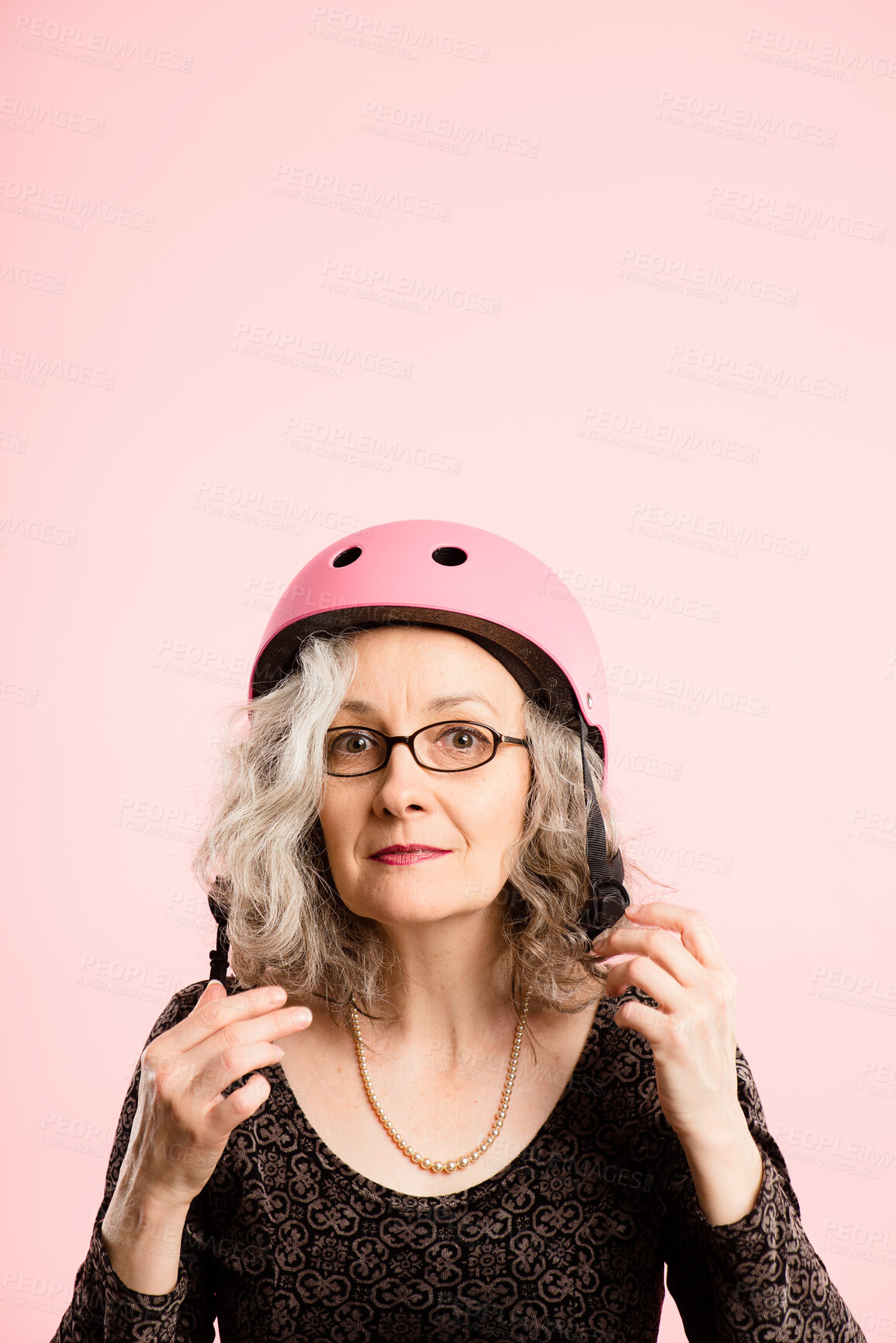 Buy stock photo Glasses, helmet and portrait of old woman in studio isolated on pink background for cycling. Eyewear, face and safety with confident senior person on mockup space for fashion, fitness or vision