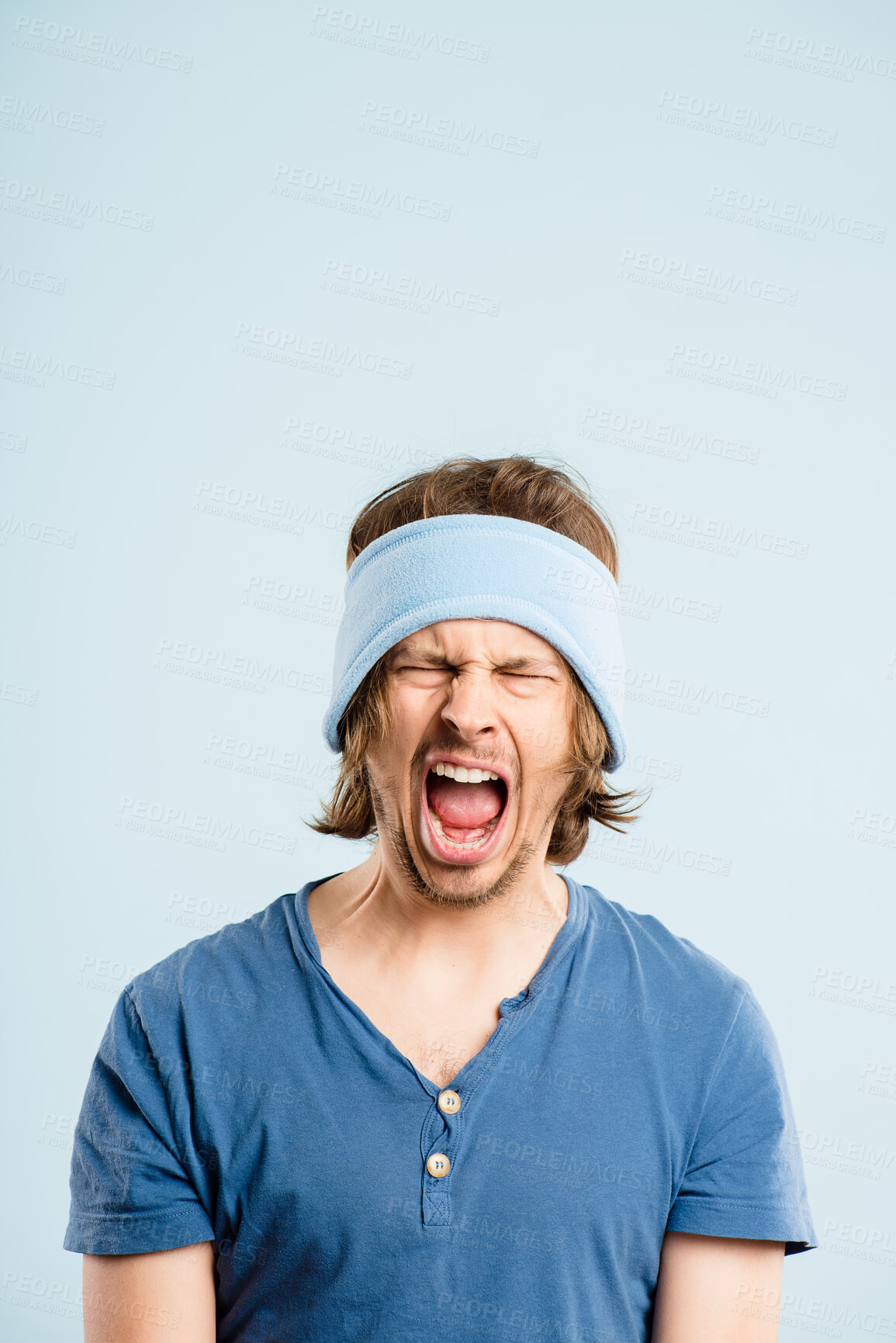 Buy stock photo Man, angry and shouting in studio, mental health and stress for pain on blue background. Male person, screaming and frustrated for information, yell and horror for announcement or healing exercise