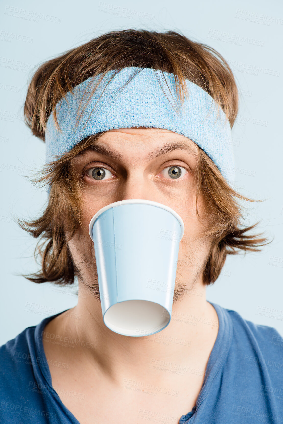 Buy stock photo Funny, goofy and portrait of man with coffee cup in studio for fitness with retro headband for workout. Caffeine addict, crazy and athlete drinking cappuccino or latte with vintage exercise fashion.