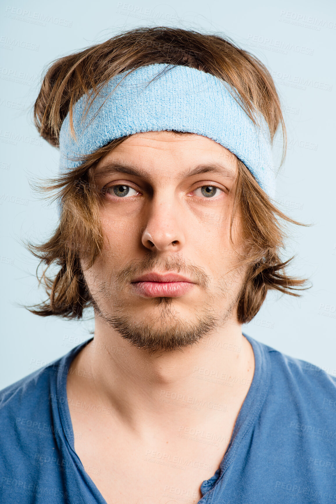 Buy stock photo Serious, workout and portrait of man with headband, retro fashion and fitness coach for gym in studio. Pride, face and male person with vintage style, exercise and bored on blue background in USA