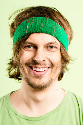 Buy stock photo Smile, fitness and portrait of man with headband, retro fashion and workout coach for gym in studio. Happy, face and male person with vintage style, exercise or funny on green background in Ireland