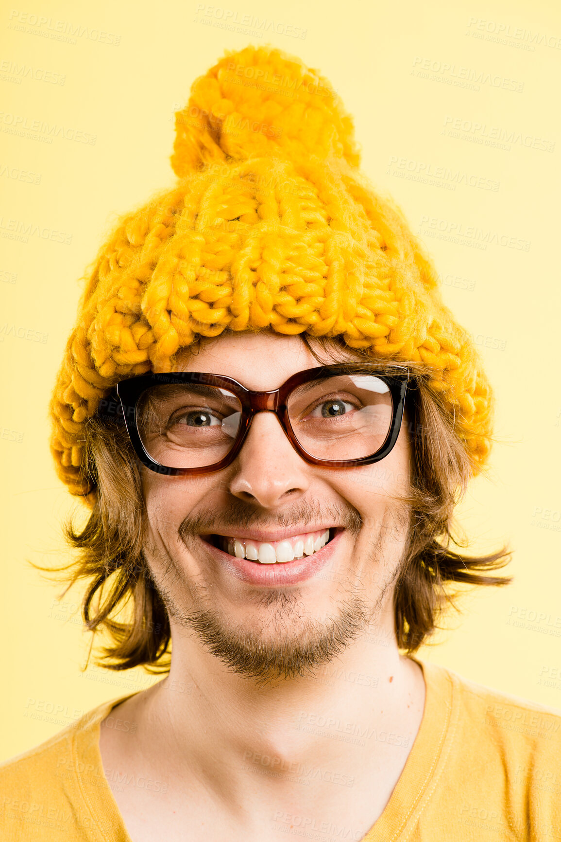 Buy stock photo Smile, man and beanie with portrait for fashion of winter weather, warm clothes and cold morning. Happy, person and knitted hat for stylish aesthetic, trendy glasses and eyewear on studio background
