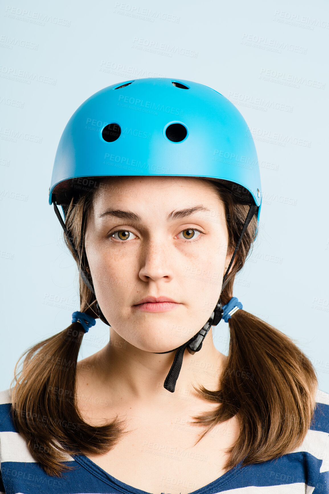 Buy stock photo Cycling, helmet and portrait of woman in studio with confidence, travel or retro aesthetic style on mockup. Bike, safety and serious face of girl with transport, casual and fashion on blue background