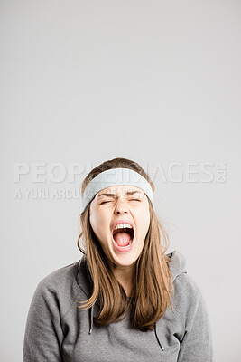 Buy stock photo Shouting, screaming and face of woman in studio with anger, upset and crazy reaction. Body language, facial expression and isolated person with loud noise, voice and announcement on gray background