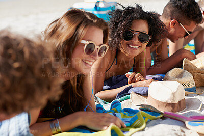 Buy stock photo Relax, happy and friends on sand at beach for summer holiday, vacation and weekend outdoors. Diversity, smile and group of men and women by ocean for social gathering, fun or chill together in nature