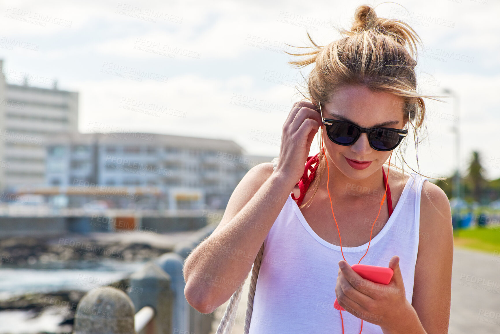 Buy stock photo Travel, woman with smartphone and earphones in city street listening to music. Traveling, technology and female person online streaming podcast or radio outside in urban a road with cellphone