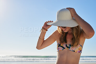 Buy stock photo Woman, happy and hat outdoor at beach for tropical holiday, adventure and summer vacation. Tourist, person and sunglasses at ocean for travel, relax and break with eyewear and fun on mockup space