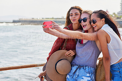 Buy stock photo Happy, women and selfie at beach on vacation for online post, summer or memory of adventure together. Friends, love and smile with digital photography by ocean water for weekend trip update in Cancun