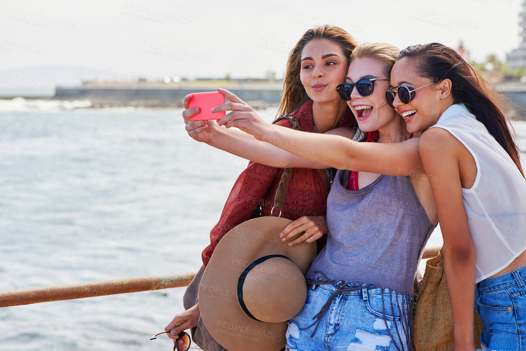 Buy stock photo Happy, women and selfie at beach on vacation for online post, summer or memory of adventure together. Friends, love and smile with digital photography by ocean water for weekend trip update in Cancun