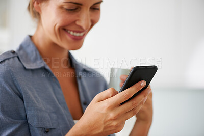 Buy stock photo Woman, coffee and happy with phone in home for reading notification, text message or scroll on social media. Person, hands and smartphone with beverage for online news, ebook and dating site in house