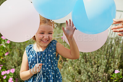 Buy stock photo Girl, child and happy with balloons in backyard for party, celebration and memory in summer sunshine. Kid, excited and smile in home garden for birthday with cheers, achievement and play in Germany