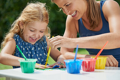 Buy stock photo Happiness, mother and daughter painting, fun with art and messy with watercolor creativity outdoor. Woman with girl, mom bonding with female child and creative activity with color paint in backyard