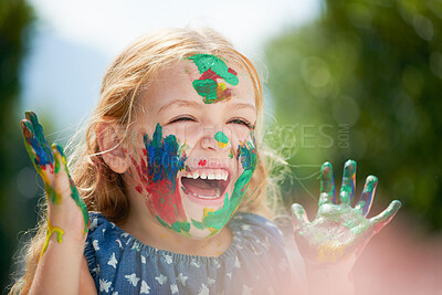 Buy stock photo Happy, little girl covered in paint and outdoors with a lens flare. Happiness or creative, playing or art fun and cheerful or excited young child with painting over her face outside in the summer