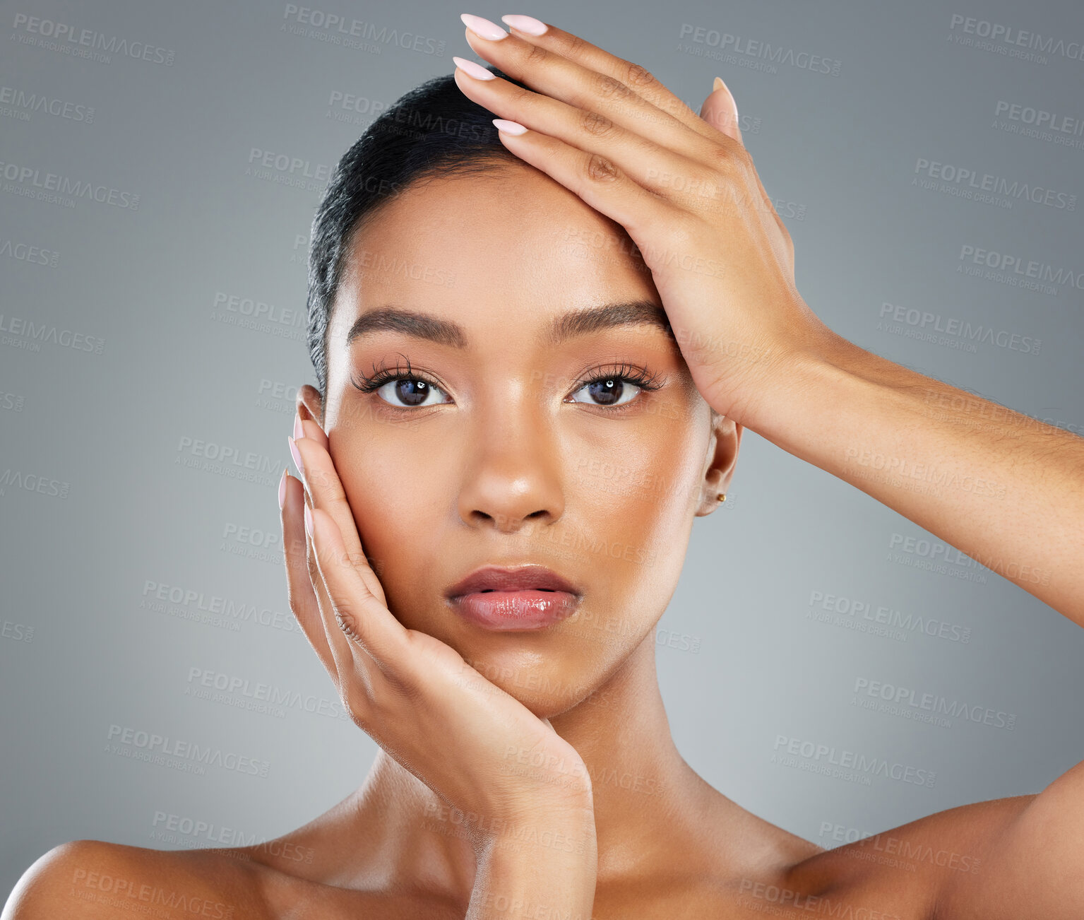 Buy stock photo Hands, makeup or portrait of woman with skincare in studio on grey background fo facial glow. Dermatology treatment, girl or face of confident model with cosmetics, beauty and transformation results