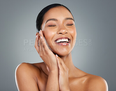 Buy stock photo Laughing, makeup or hands of woman with beauty in studio on grey background for facial glow. Cosmetology, happy girl or face of proud model with cosmetics, skincare results or dermatology treatment