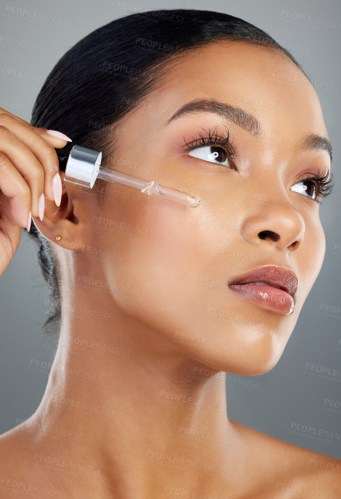 Buy stock photo Woman, dropper and serum with beauty in studio for collagen treatment, skin hydration and skincare. Mockup, oil and cosmetics product with hyaluronic acid, retinol and wellness on gray background