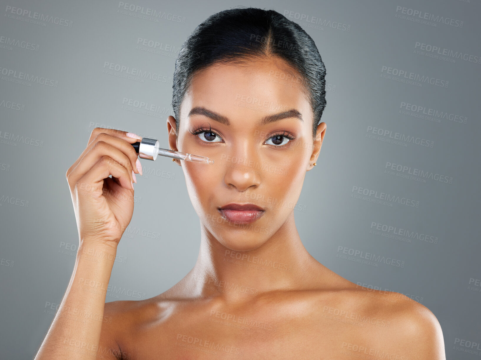 Buy stock photo Woman, beauty and oil dropper in studio portrait, product natural glow and wellness by background. Girl, person and model with cosmetics, serum and test with process for transformation in Costa Rica