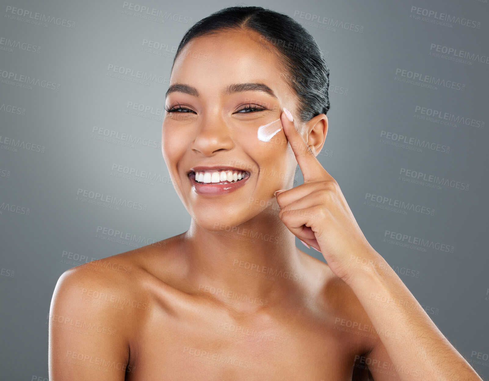 Buy stock photo Girl, portrait and moisturizer with beauty in studio for collagen treatment, skin hydration and skincare. Mockup, happy and cream product with hyaluronic acid, retinol or wellness on gray background