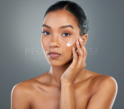 Buy stock photo Woman, portrait and creme with beauty in studio for collagen treatment, skin hydration and skincare. Mockup, cream and cosmetics product with hyaluronic acid, retinol and wellness on gray background