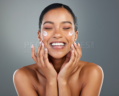 Buy stock photo Woman, face and creme with beauty in studio for collagen treatment, skin hydration and skincare. Mockup, happy and cream cosmetics product with hyaluronic acid, retinol or wellness on gray background