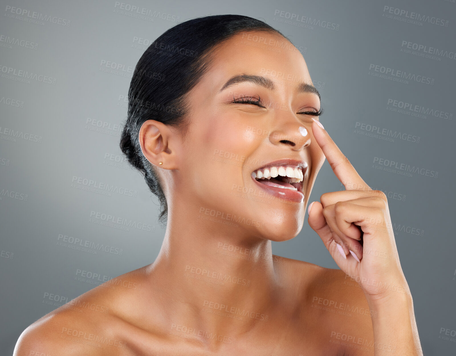 Buy stock photo Woman, skincare and cream on nose in studio for test, process and laughing with beauty by background. Girl, person and model for touch with cosmetics, makeup and moisturizer serum for transformation