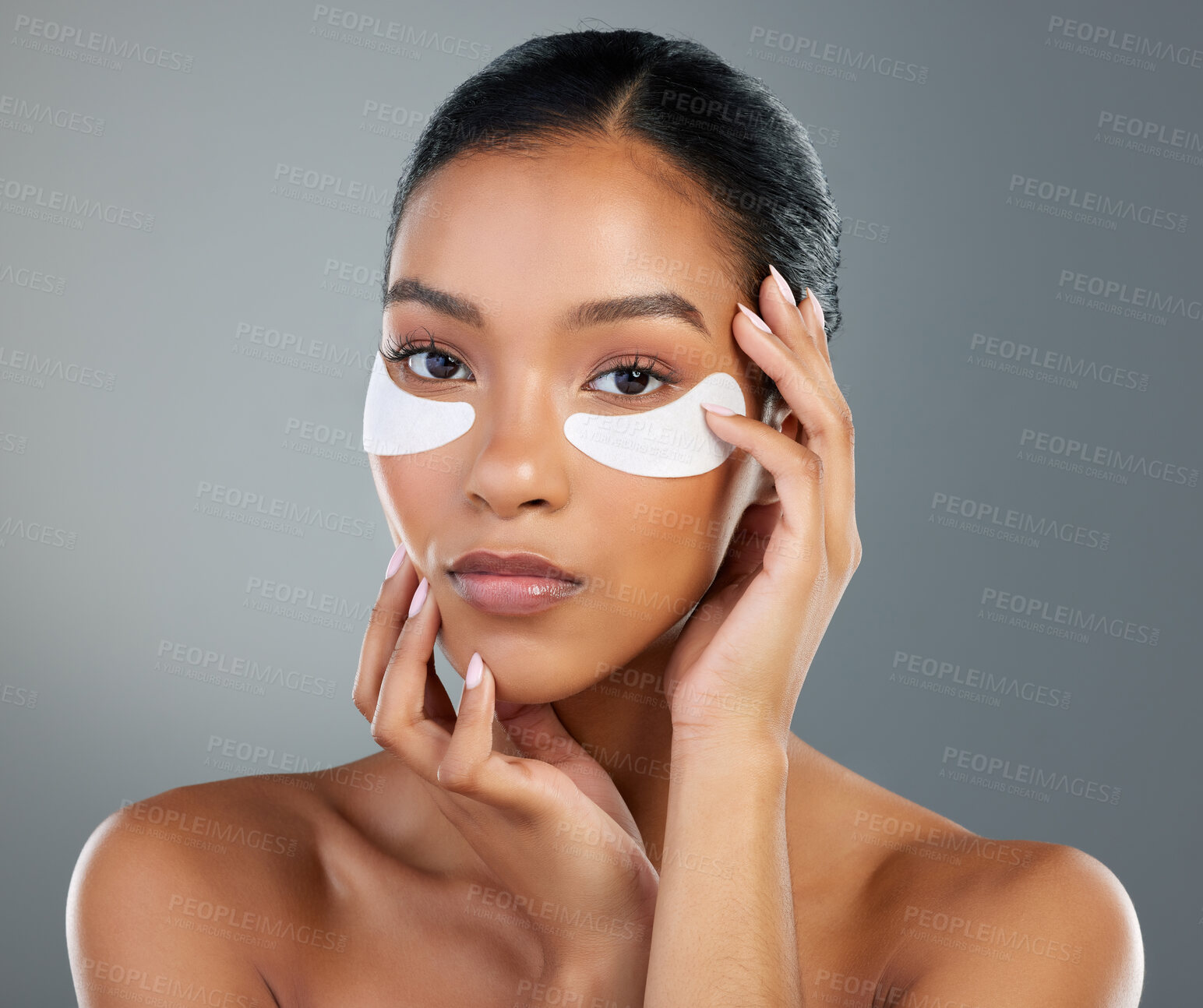 Buy stock photo Woman, skincare and eye patch in studio portrait with process, test and wellness by background. Girl, model and person with cosmetics, dermatology and pads with facial transformation in Brazil