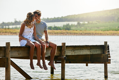Buy stock photo Couple sitting on jetty, relax by lake and summer, travel and adventure, love and care outdoor. People in relationship, trust and bonding on vacation, man and woman with freedom and forehead touch