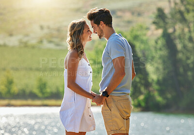 Buy stock photo Couple holding hands, relax by lake and summer, travel and adventure with love and care outdoor. People in relationship, trust and bonding on vacation, man and woman with happiness and freedom