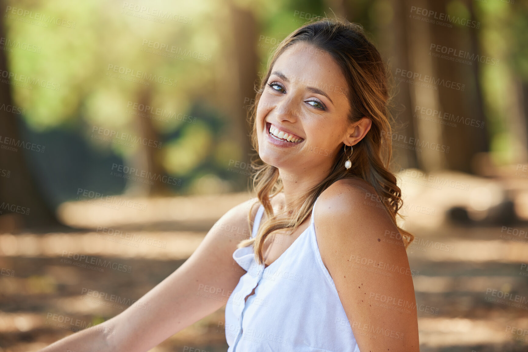 Buy stock photo Nature, happy and portrait of a woman in a forest on an outdoor adventure, explore or travel. Happiness, smile and face of a young female model posing in the woods with a positive mindset in summer.