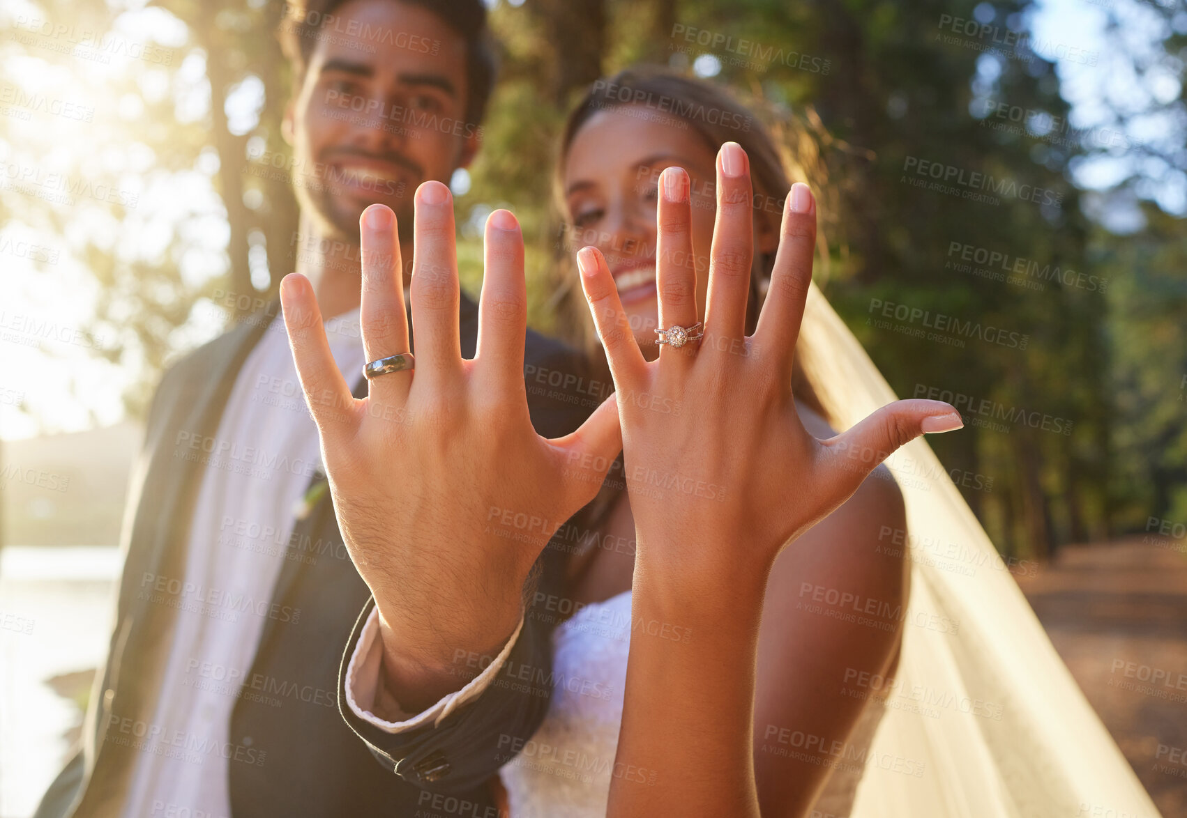 Buy stock photo Hands, married and wedding ring with a couple standing outdoor together as newlyweds after their ceremony. Love, marriage or commitment with a bride in groom in celebration of their matrimony