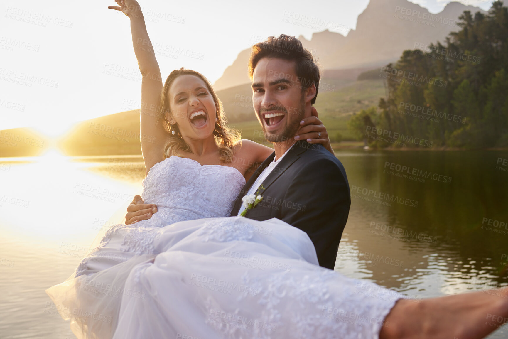 Buy stock photo Wedding, lake and groom carrying bride in nature and water with passion, smile and romance. Marriage, excited happy couple celebrate love and romantic relationship, loving man and woman together.