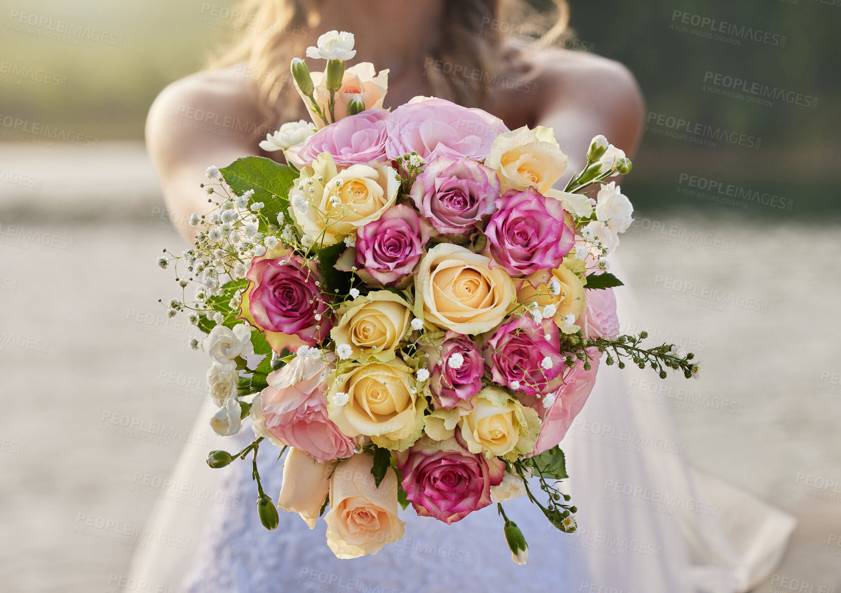 Buy stock photo Closeup, bride and flower bouquet outdoor for celebration of commitment, ceremony and marriage. Woman, wedding and holding roses, spring flowers and floral blossom to celebrate love at elegant event 