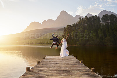 Buy stock photo Rearview shot of an unrecognizable bride and groom on their wedding day