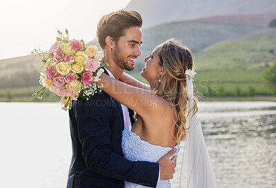 Buy stock photo Wedding, couple hug and lake with a bride feeling love, care and support from marriage together. Nature, flower bouquet and young people with a happy smile from trust and commitment event by water