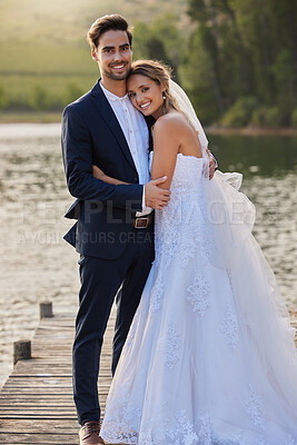 Buy stock photo Happy wedding couple, hug and smile by lake for romantic honeymoon getaway in nature. Man and woman hugging in happiness for marriage relationship or embrace in loving commitment in the outdoors