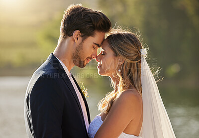 Buy stock photo Couple, wedding and forehead by lake on romantic honeymoon or summer getaway together in nature. Married man and woman touching head for marriage, relationship or loving embrace in the outdoors